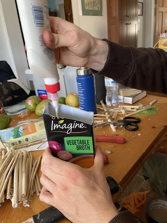 pouring glue into box